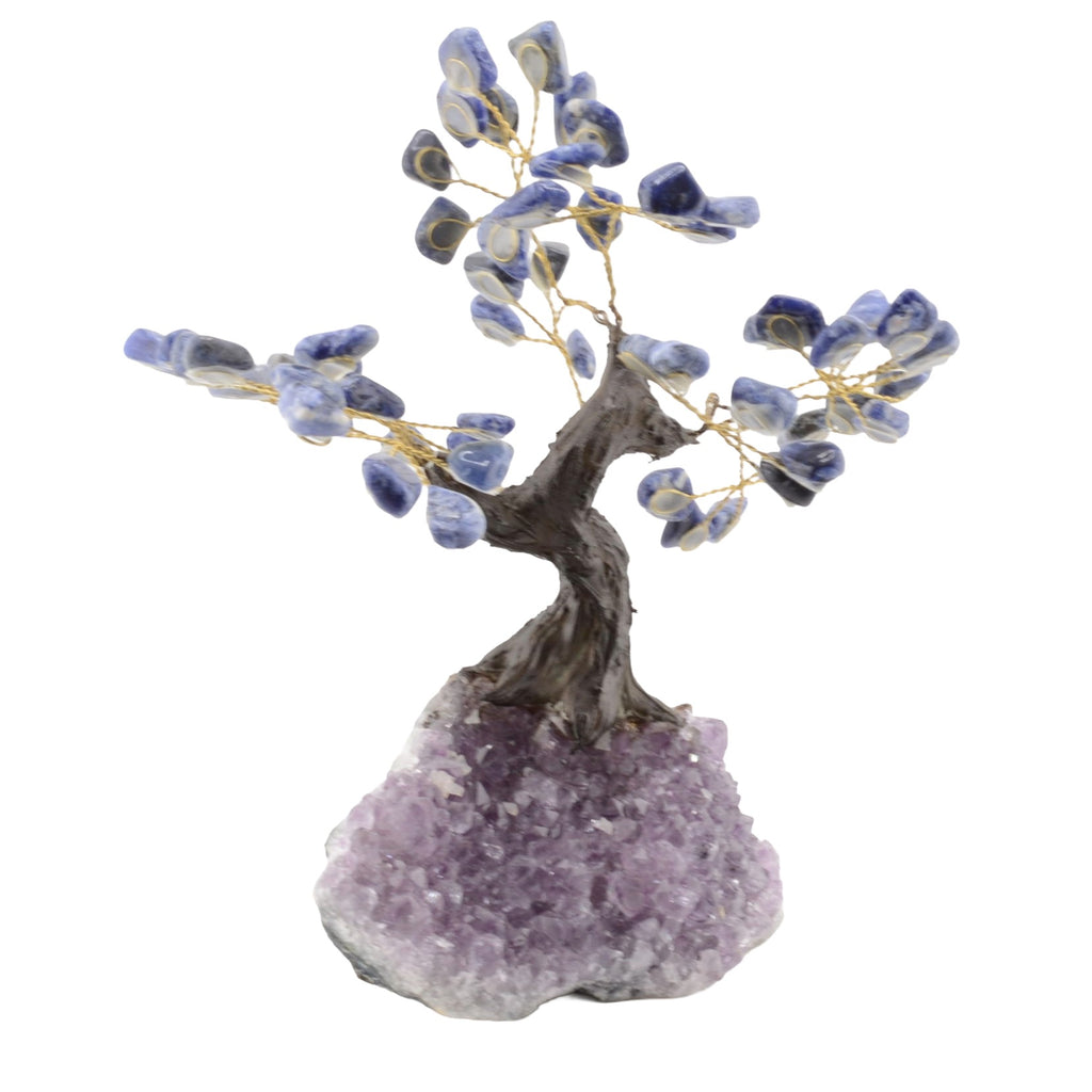A decorative bonsai-style tree sculpture with blue and white sodalite gemstone leaves, gold-tone wire branches, a brown faux-wood trunk, and an amethyst geode base on a plain white background.
