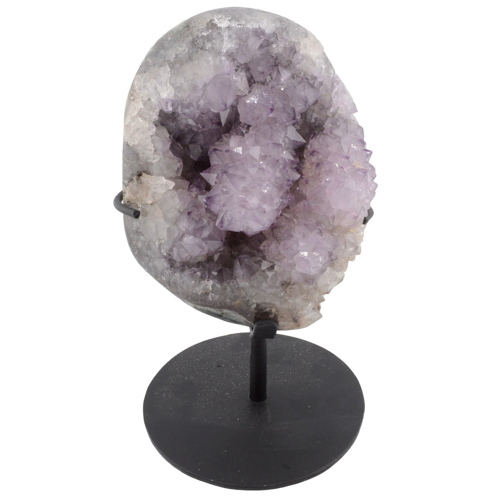 Amethyst geode crystal cluster on a black metal stand, photographed against a plain white background.