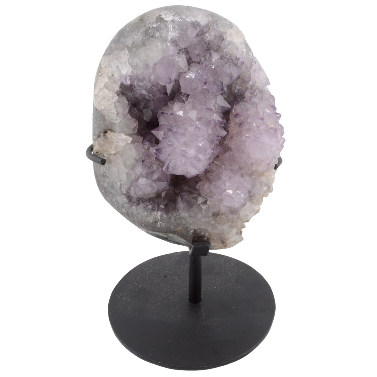Amethyst geode crystal cluster on a black metal stand, photographed against a plain white background.