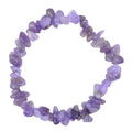 A beaded stretch bracelet made of irregular, polished purple amethyst tumbled stones, arranged in a circle on a plain white background.