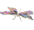 A metallic dragonfly body with iridescent, rainbow-colored aura kyanite wings and a silver body, shown against a plain white background.