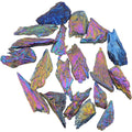 A collection of aura kyanite blades with an ridescent rainbow sheen, showing blue, purple, pink, and gold tones on a plain white background.