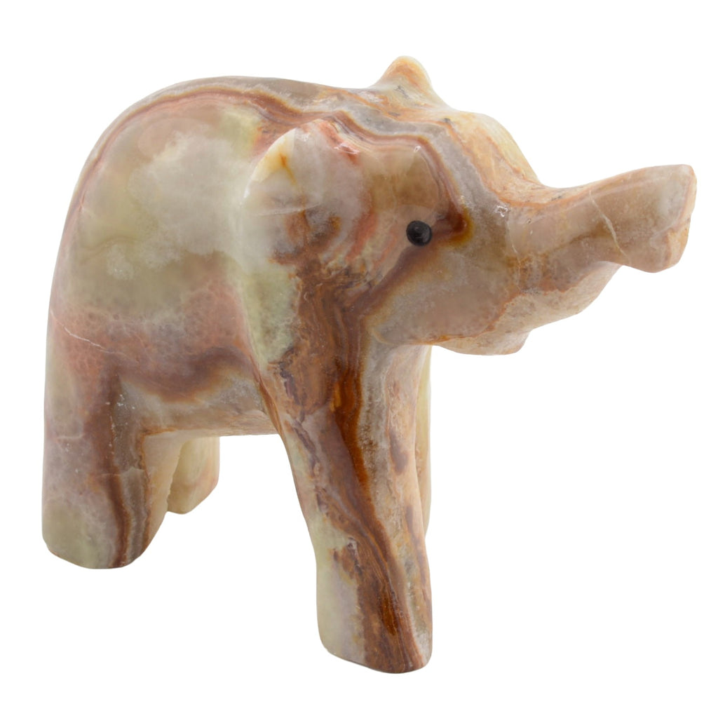 A carved elephant figurine made from banded calcite with natural brown, beige, and cream patterns, set against a plain white background.