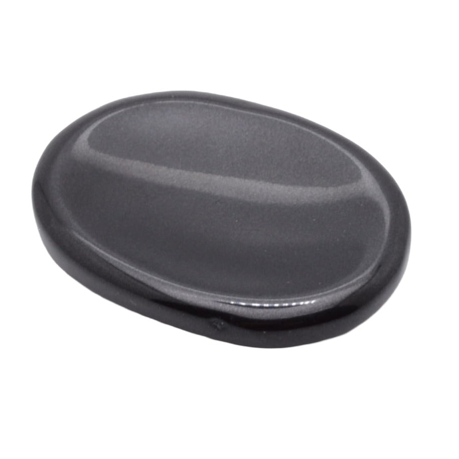 A smooth, polished black oval worry stone shown on a plain white background.