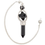 A Black Obsidian Pendulum featuring a point and merkaba. It has a silver coloured chain with bead. Pictured on a white background