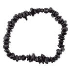 A black tourmaline gemstone chip bead bracelet made of polished irregular dark beads, photographed on a plain white background.