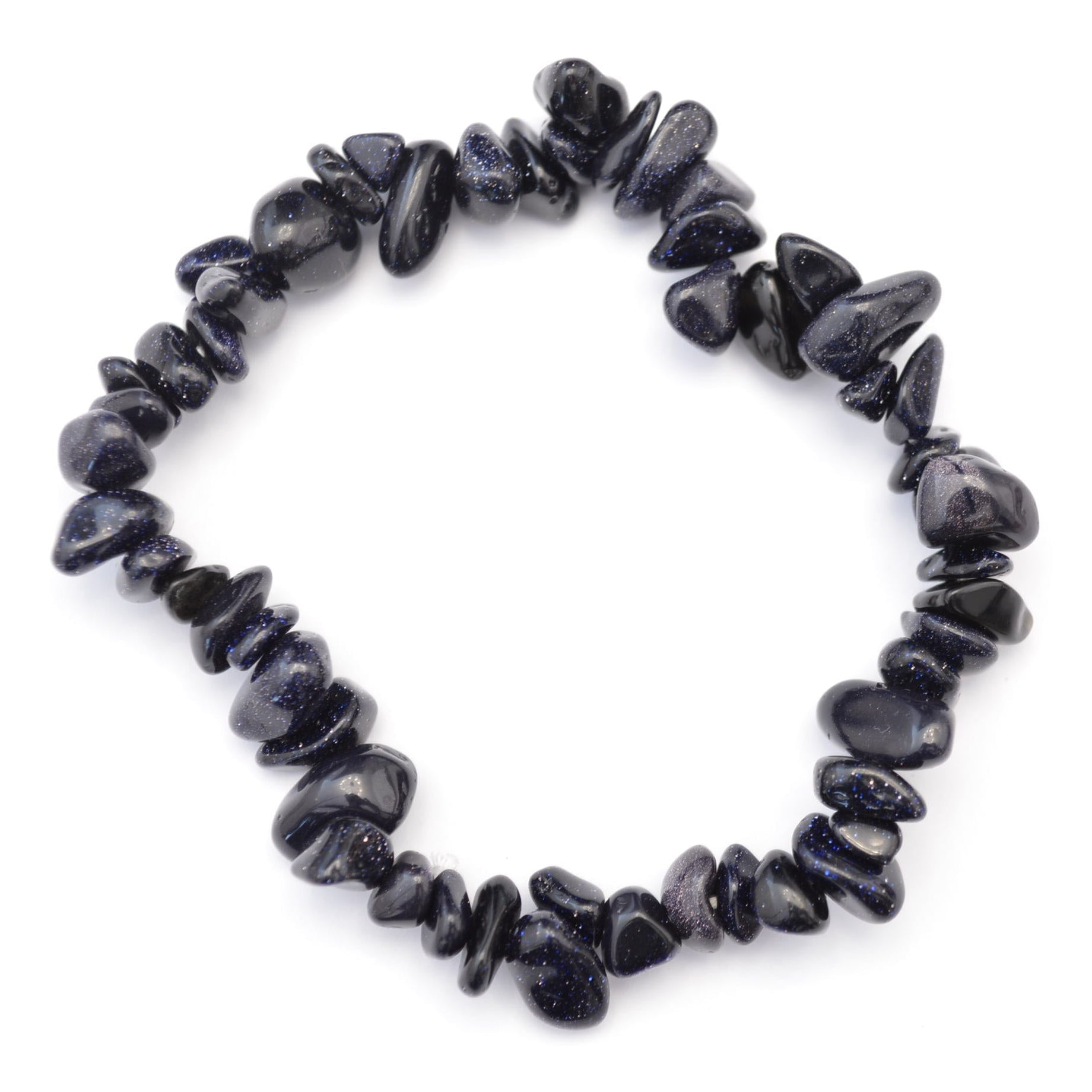 A beaded stretch bracelet made of small, dark polished stone chips of blue goldstone arranged in a circular shape on a plain white background.