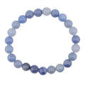 A beaded stretch bracelet made of blue quartz 8mm round, polished blue-gray beads, arranged in a circular shape against a plain white background.