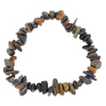 A beaded stretch bracelet made of polished blue tiger's eye stone chips, arranged in a circle on a plain white background.