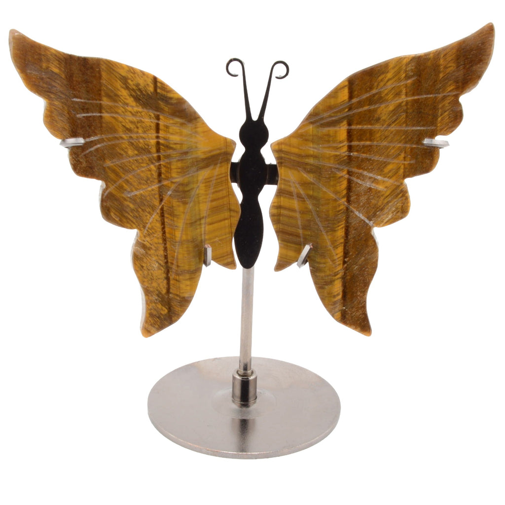 A decorative butterfly-shaped shelf piece with large warm brown Tigers Eye Gemstone wings, a black butterfly body, and a silver metal stand on a plain white background.