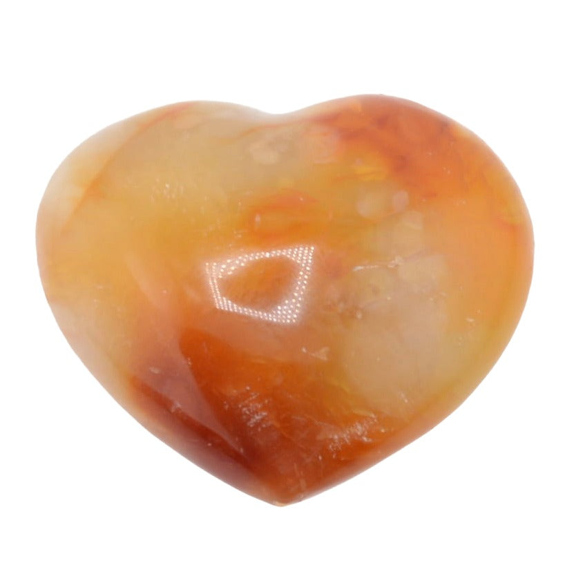 A heart-shaped polished carnelian gemsont with marbled orange, amber, and pale cream tones, shown on a plain white background.