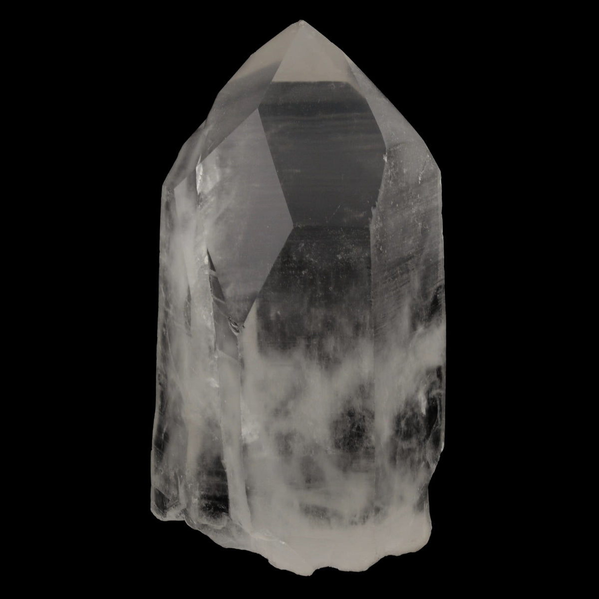 A natural clear quartz point crystal with internal inclusions, shown against a solid black background.