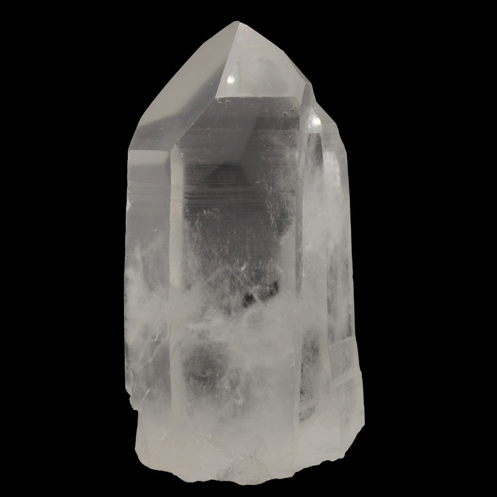 A natural clear quartz crystal point with visible internal inclusions and a rough, unpolished base, photographed against a solid black background.