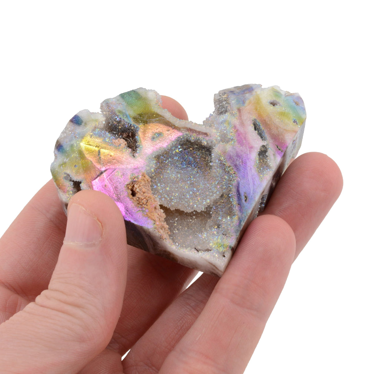 A hand holding a  Druzy Rainbow Aura Sphalerite Heart Shaped Carving. Measuring 72mm on a white background