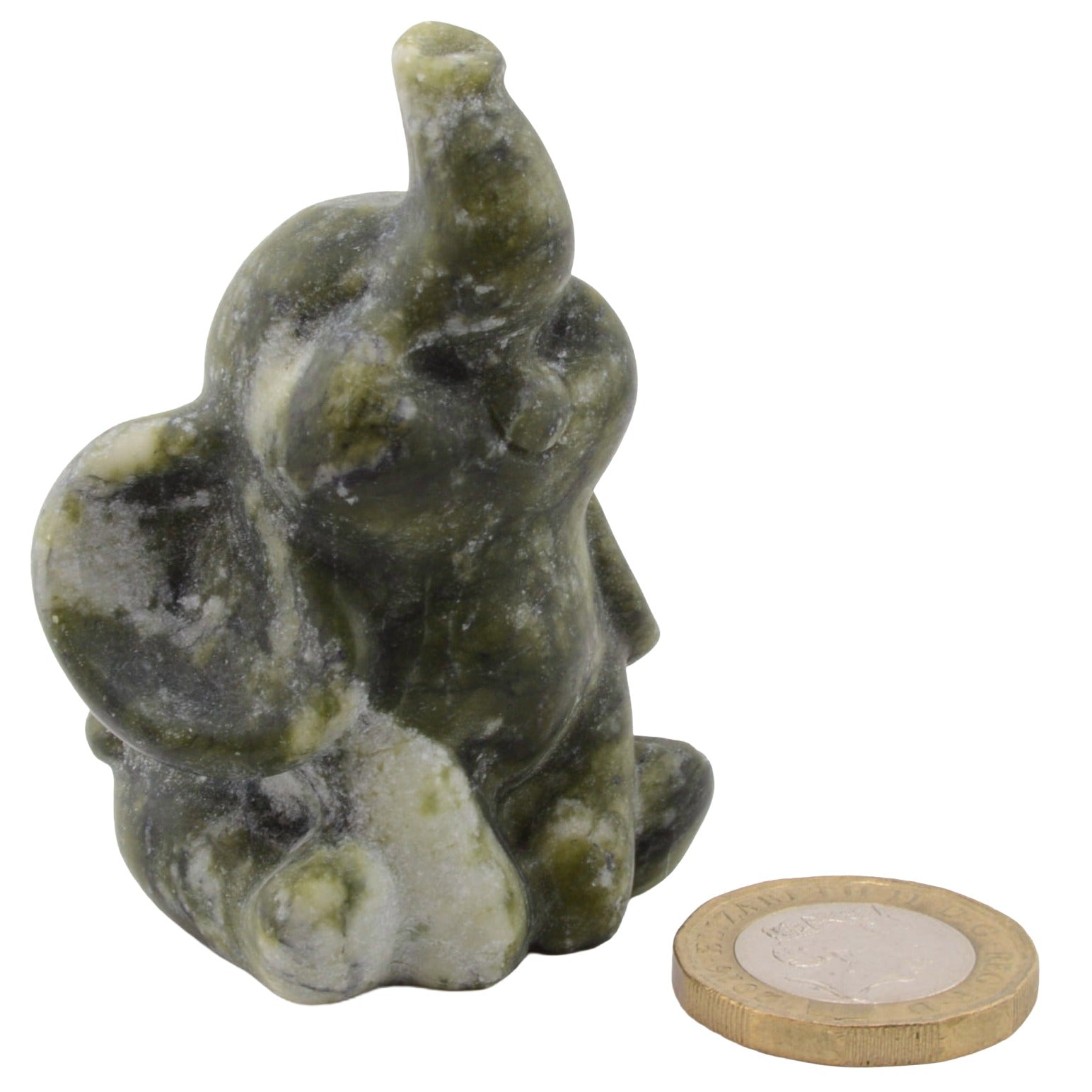 A 6cm carvedelephant figurine in olive green and white marbled nephrite jade gemstone, shown next to a UK 10p coin for scale on a plain white background.