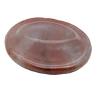 A polished oval-shaped reddish-brown fancy jasper worry stone with natural marbling and a smooth, glossy finish, isolated on a white background.