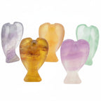 Five Fluorite Crystal carved angel figurines in different colors, arranged on a plain white background.