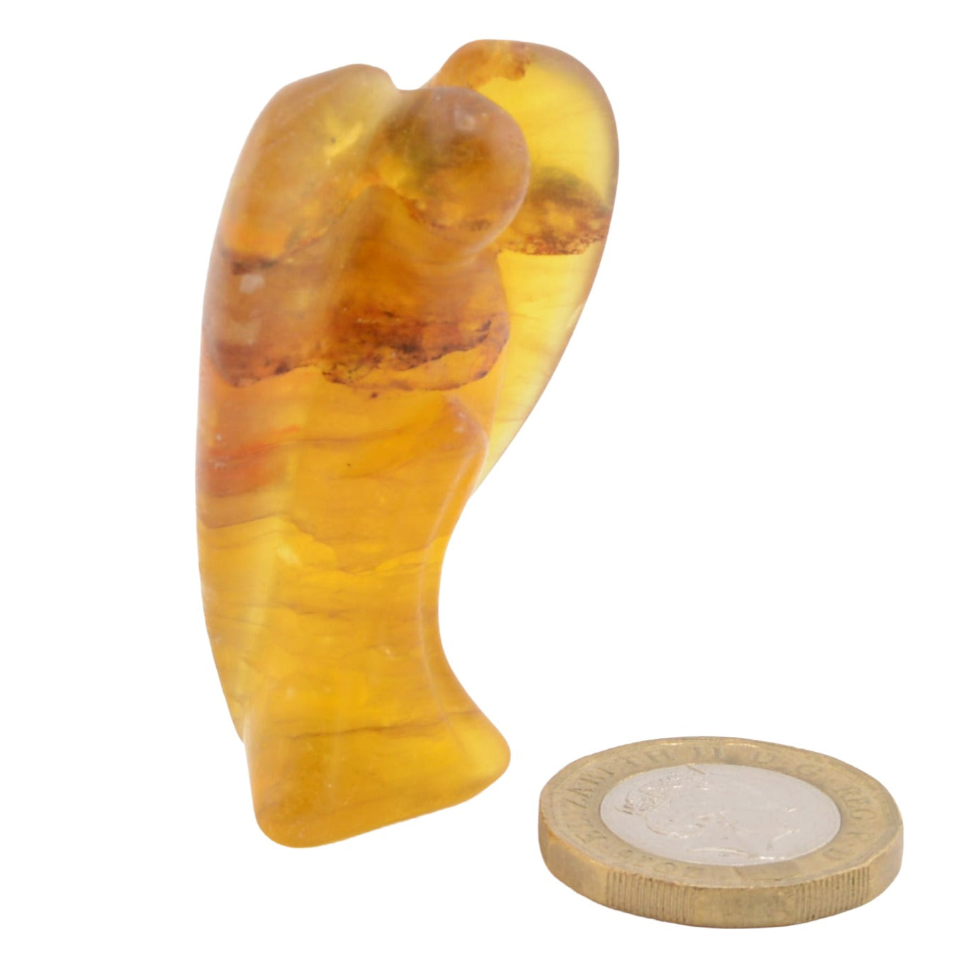 A small Fluorite Crystal Carved amber figurine shaped like a standing angel figure, shown next to a UK coin for scale on a plain white background.