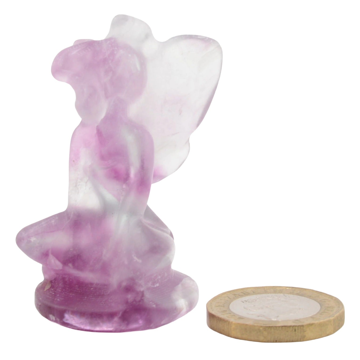 A small purple fluorite crystal flower fairy figurine with wings, shown next to a gold coin for scale on a white background.