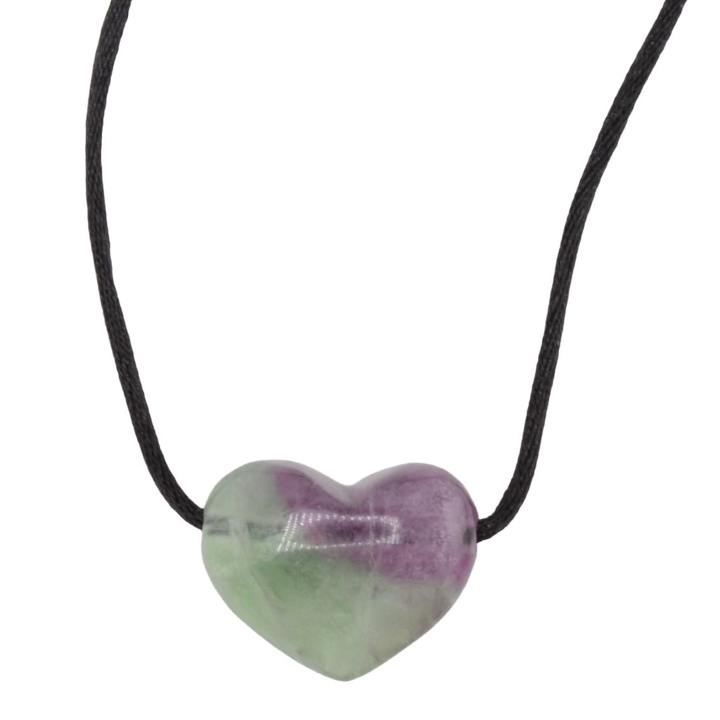 A heart-shaped fluorite crystal pendant necklace with a marbled purple and green pattern, suspended on a simple black cord against a plain white background.