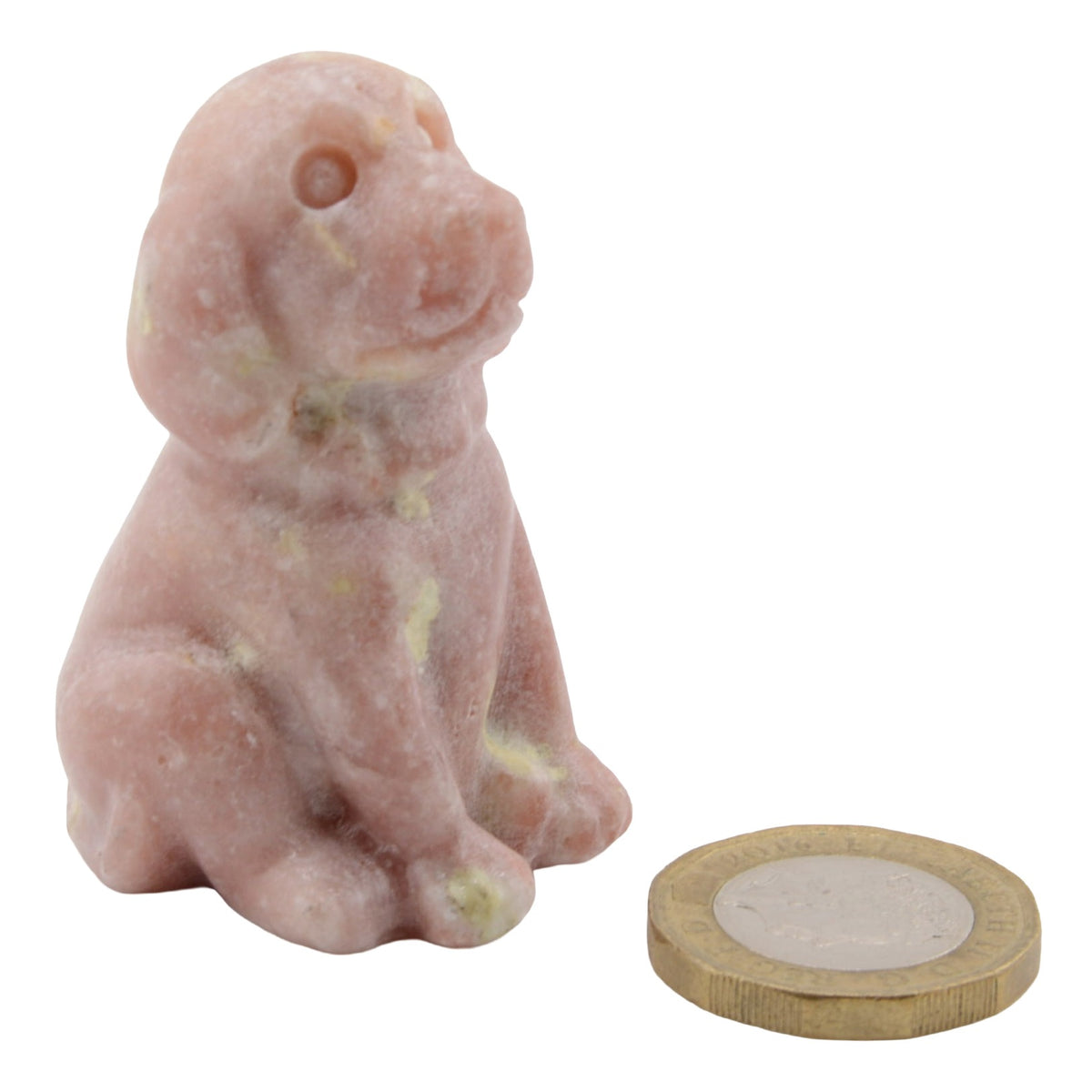 A small pink gemstone dog figurine shown next to a coin for scale, on a plain white background.