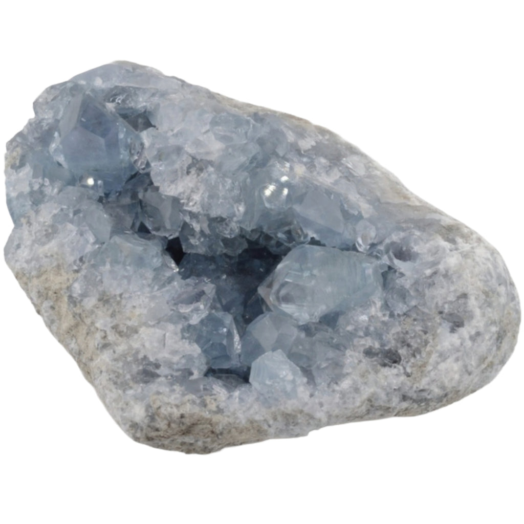 A natural grade A+ celestite crystal geode specimen with light blue translucent crystals set in a rough, earthy gray matrix, isolated on a white background.