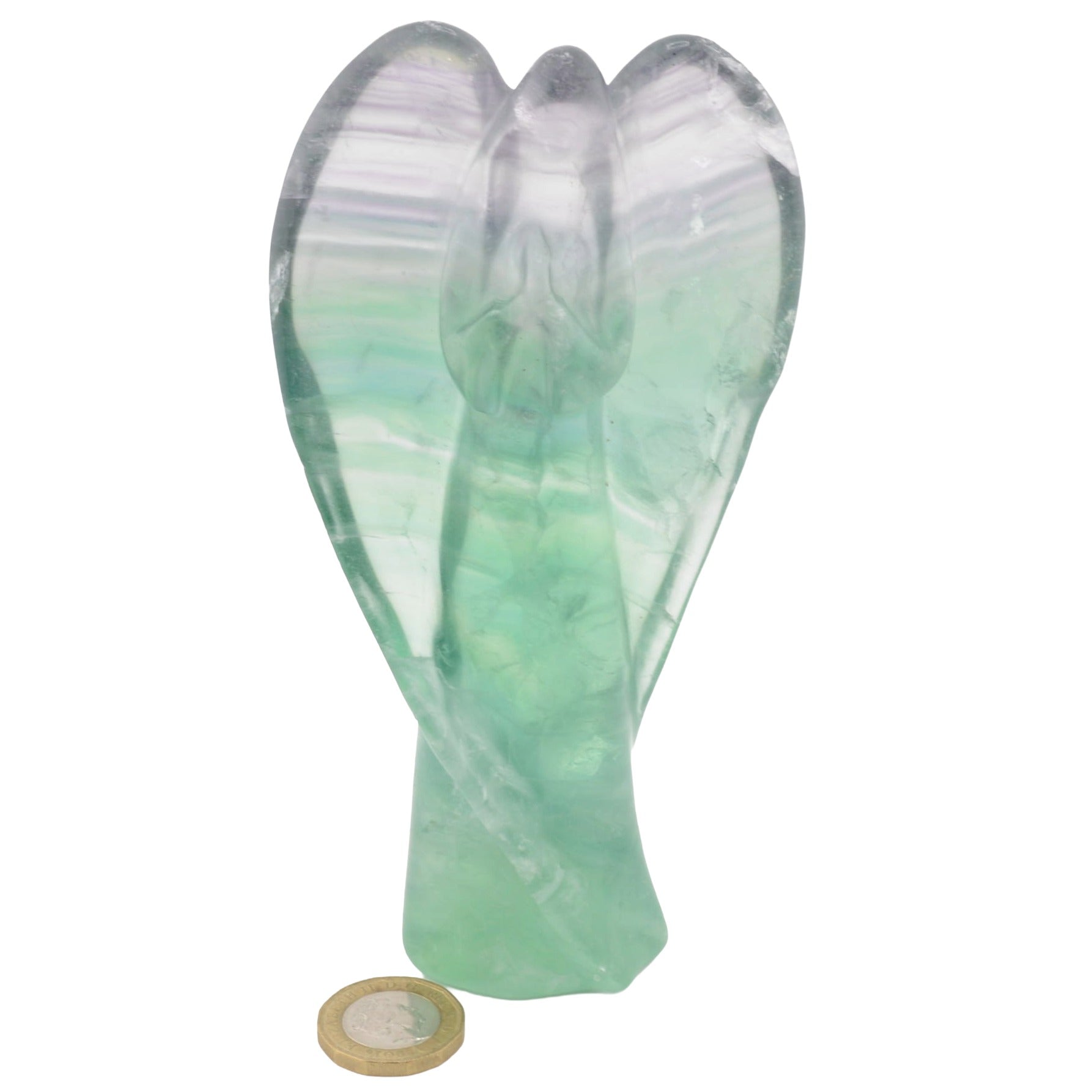 A carved angel figurine made of rainbow green and purple fluorite, shown upright on a plain white background with a small coin below for scale.