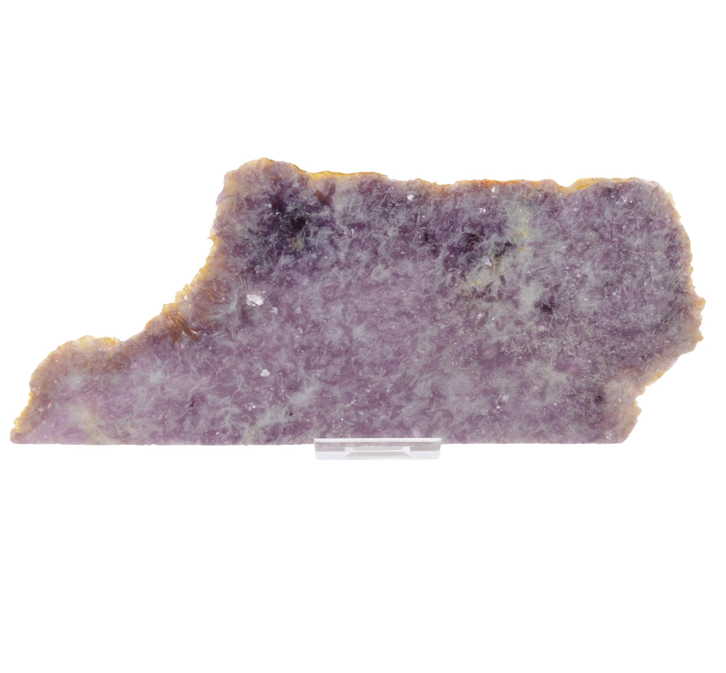 A raw purple lepidolite crystal slab with natural rough edges and a light tan matrix, displayed on a small clear plastic stand against a white background.