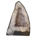 A large 225mm 13.25Kg natural amethyst geode specimen with a pointed triangular shape, featuring a dark outer matrix and a pale lavender-gray crystalline interior, photographed against a plain white background.