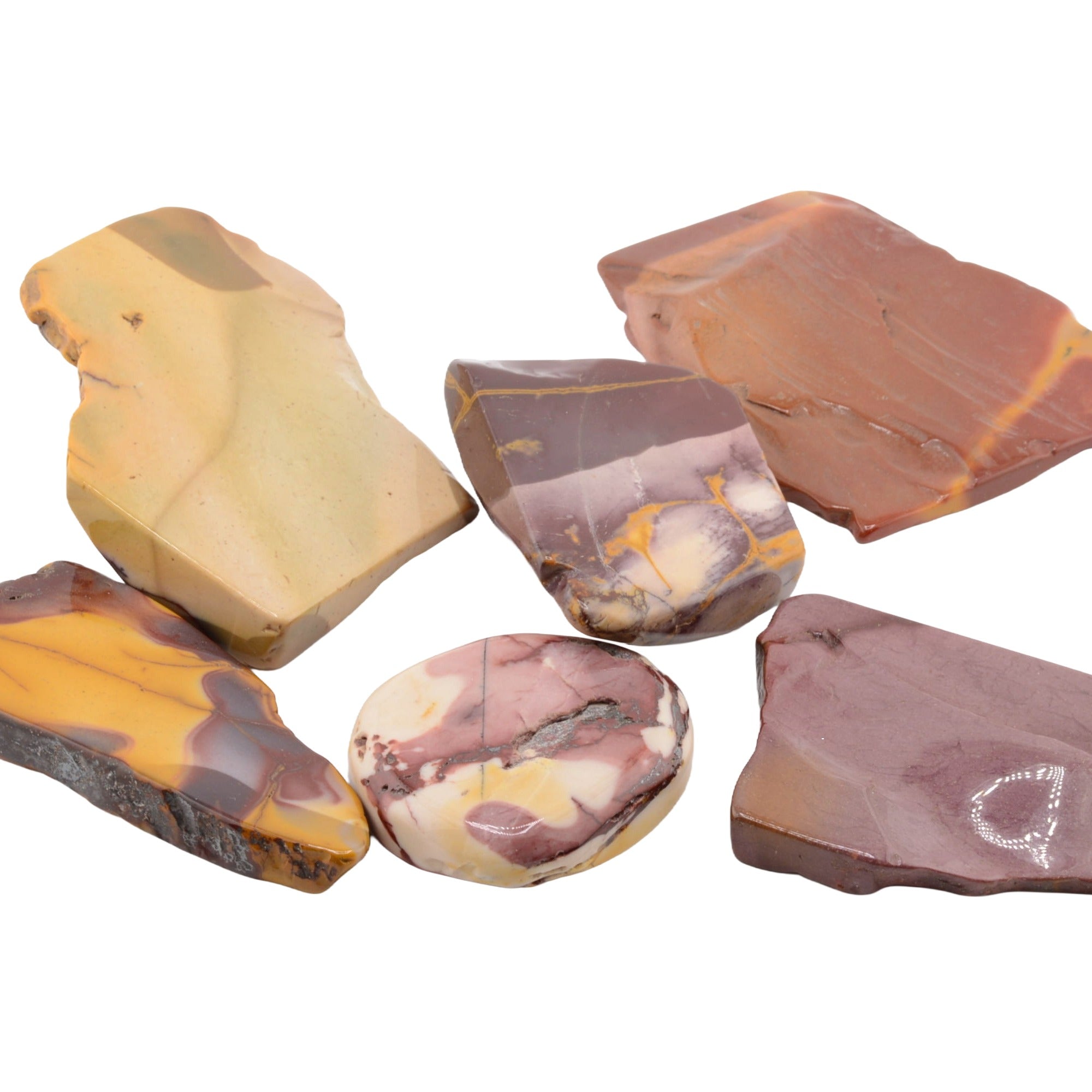 Six polished natural mookaite slabs in assorted earthy colors, including yellow, brown, purple, and cream, arranged on a plain white background.