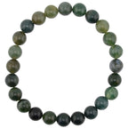 A beaded stretch bracelet made of polished moss agate gemstone beads in shades of green, dark forest green, arranged in a circular shape on a plain white background.