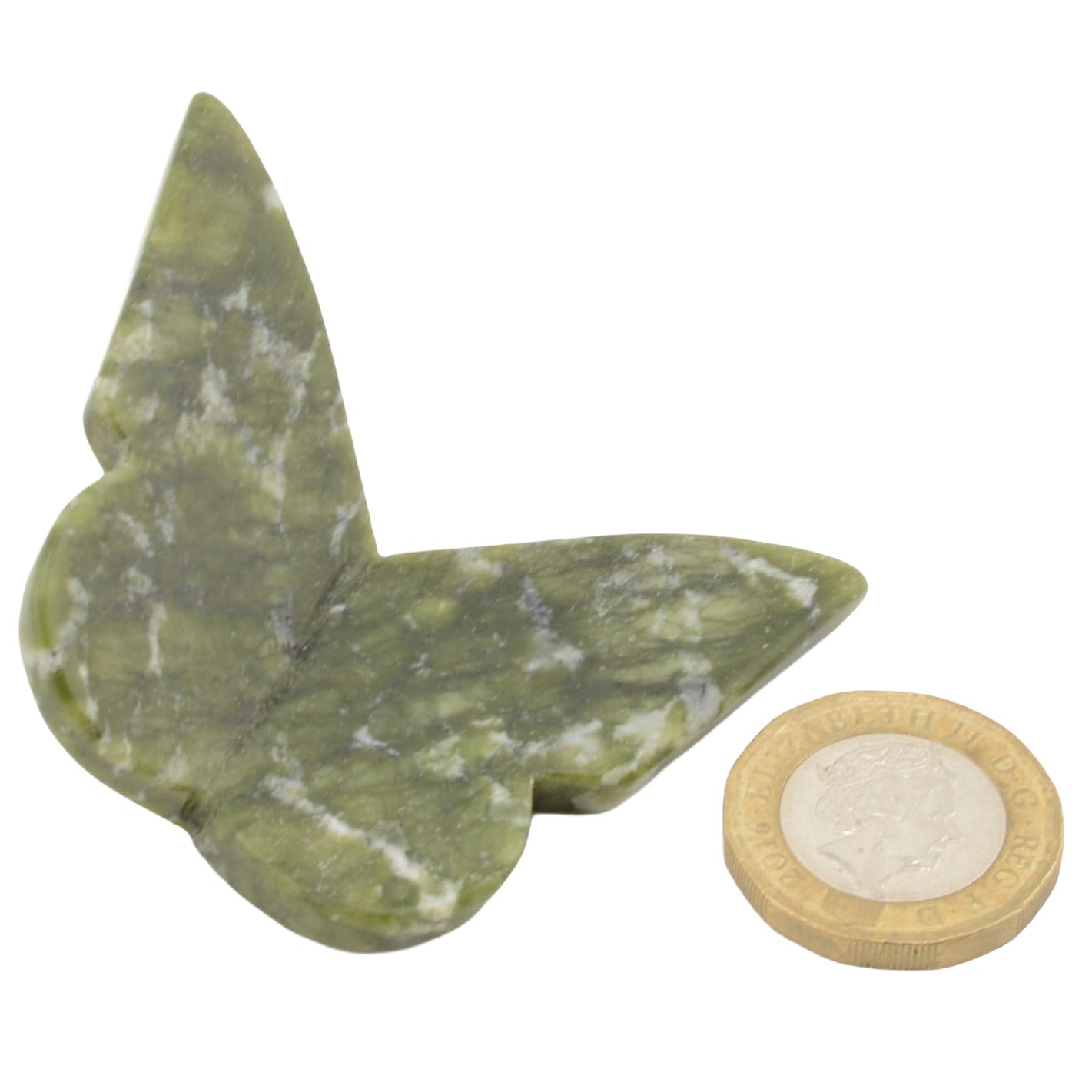 A green nephrite jade gemstone butterfly shown on a plain white background, with a coin placed beside it for size reference.
