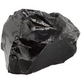 A rough, unpolished black obsidian stone with sharp, jagged edges and a glossy, reflective surface, isolated on a solid white background.