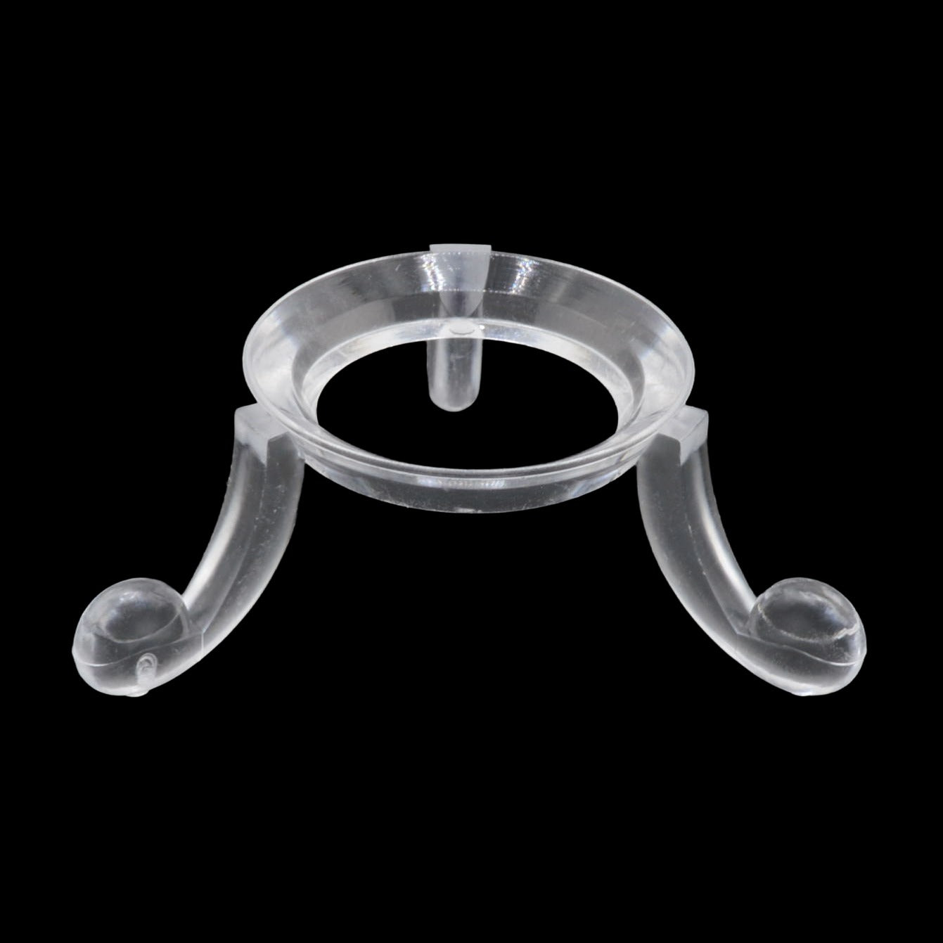 A clear acrylic jewelry display stand with a circular top and two curved legs, shown against a solid black background.