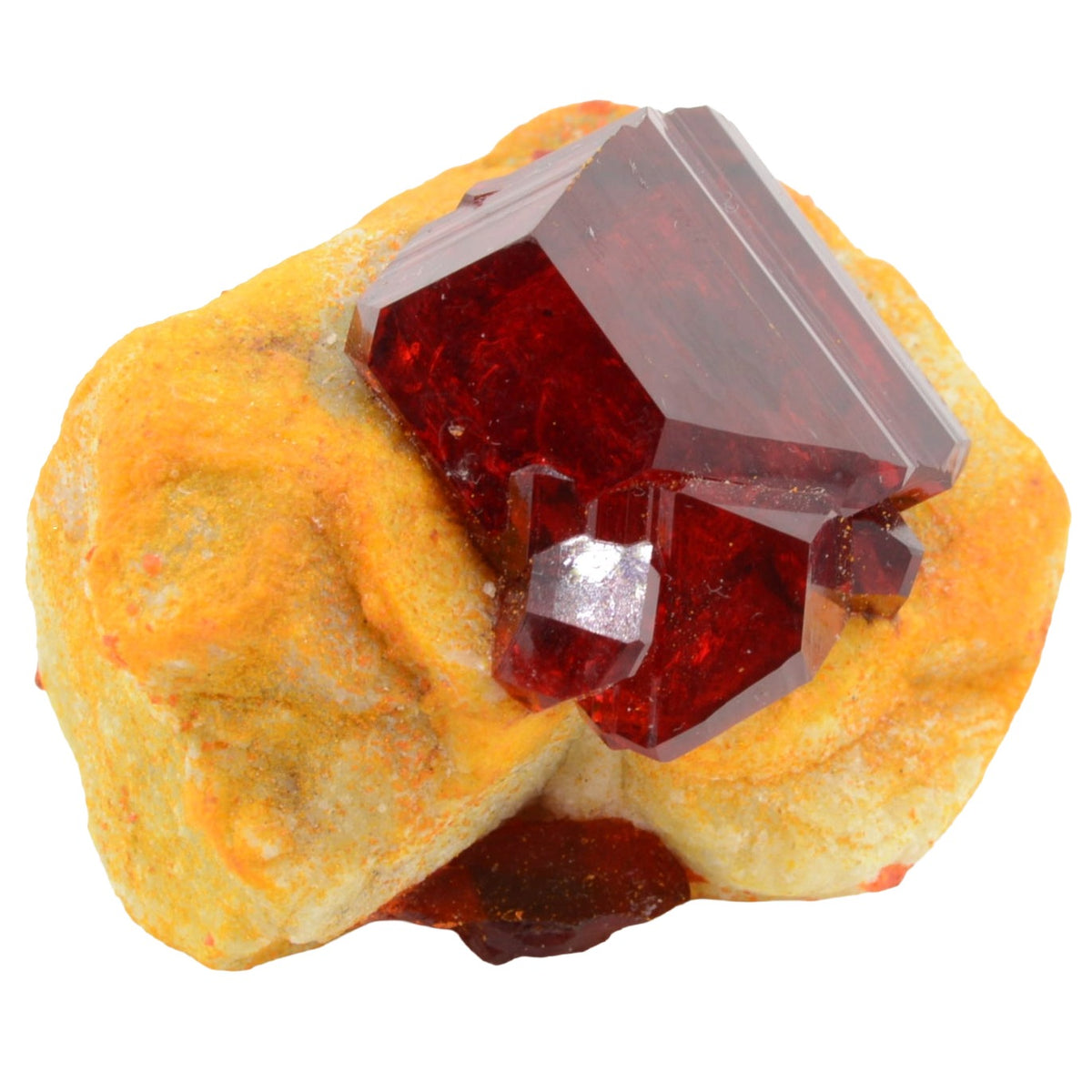 A natural pruskite crystal gemstone specimen featuring a large, faceted deep red crystal mounted on a textured, orange-yellow matrix, isolated on a white background.