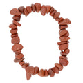 A circular beaded bracelet made of small, irregular reddish-brown red jasper stone chips, displayed on a clean white background.