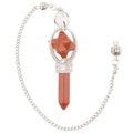 A Red Jasper Pendulum with a point and merkaba. Includes a silver coloured chain and ball n a white background