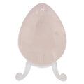 A polished rose quartz crystal egg displayed on a small clear acrylic stand against a plain white background.