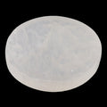 A round, semi-translucent white selenite circle charging plate, shown against a solid black background.