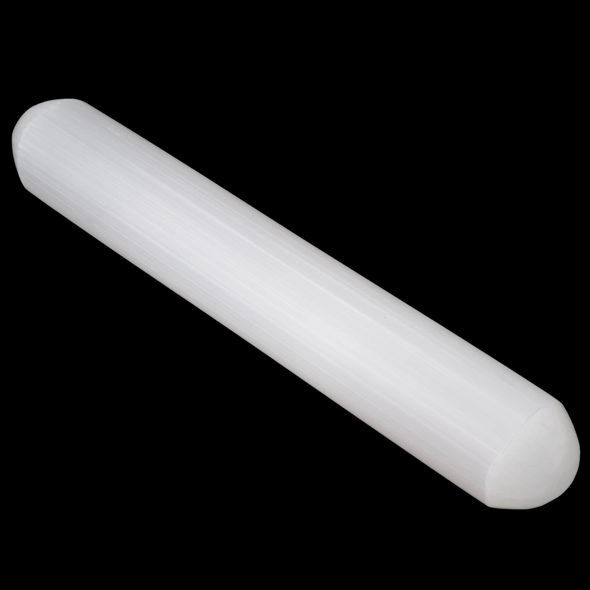 A translucent white cylindrical rod with rounded ends, made from selenite. Shown diagonally against a solid black background.