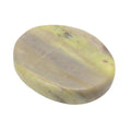 A polished oval-shaped serpentine worry stone with natural marbling in green, beige, and grayish-brown tones, shown on a plain white background.