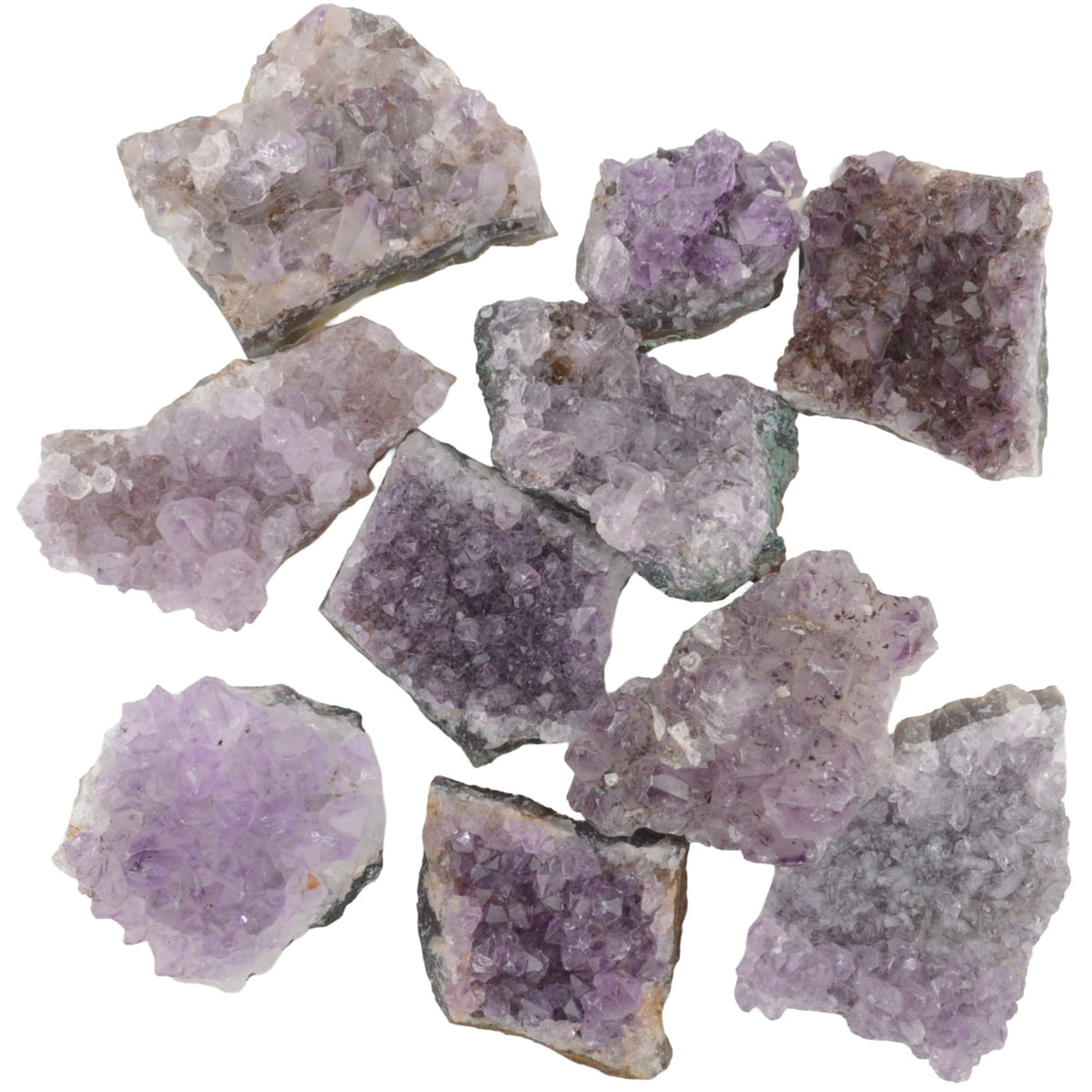 A group of rough amethyst crystal clusters with natural jagged edges, showing various shades of purple and lavender, isolated on a white background.