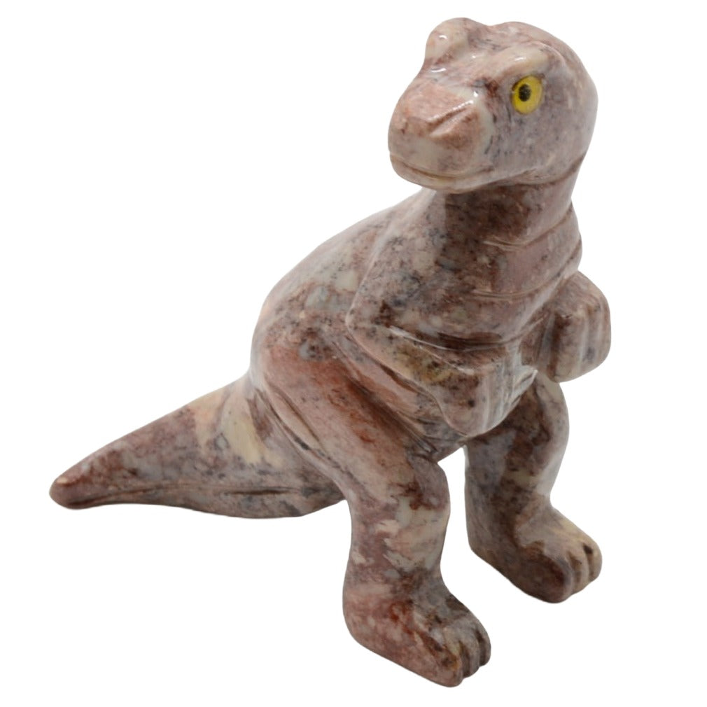 A small carved dinosaur figurine, made of soapstone, featuring a textured pinkish-brown and beige marbled pattern with a bright yellow eye, isolated on a white background.