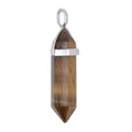 Tigers Eye double terminated point pendant with a silver plated bail, on a white background