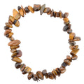 A chip stretch bracelet made of polished tiger's eye stone chips, arranged in a circle on a solid white background.