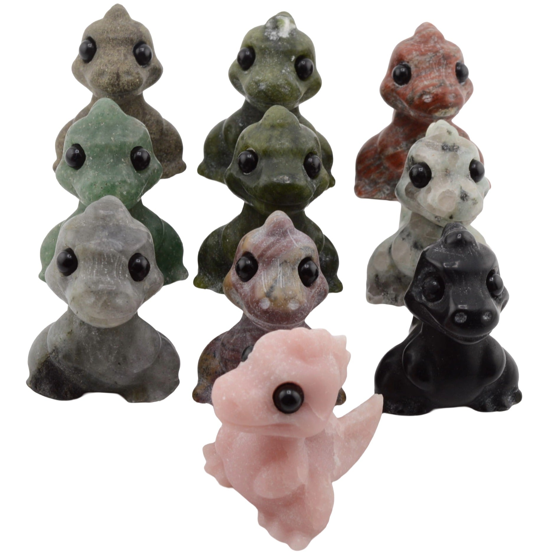 A group of 10 small gemstone Cartoon T_Rex figurines, shown on a plain white background. The set includes multiple color variants: gray, olive green, reddish brown, white, pink, black, and a lavender-brown tone.