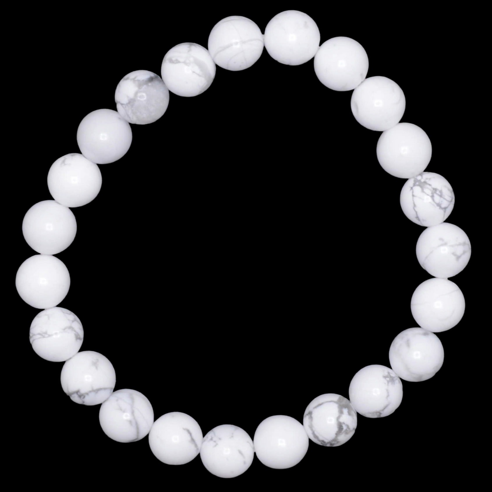 A beaded stretch bracelet made of white marble-like white howlite gemstone beads with subtle gray veining, displayed against a solid black background.