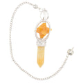 A silver-toned chain necklace featuring a yellow jasper point & merkaba pendulum with a faceted orange star-shaped, set in ornate silver filigree.