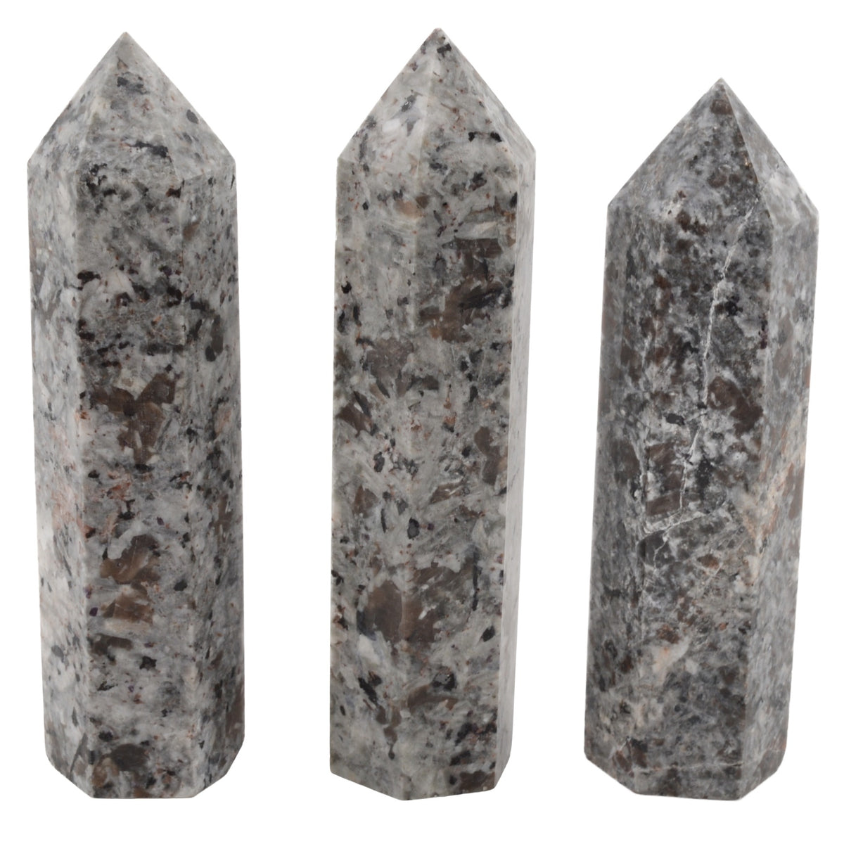 Three polished yooperlite crystal obelisks with natural speckled patterns in gray, white, black, and brown, arranged side-by-side on a plain white background.